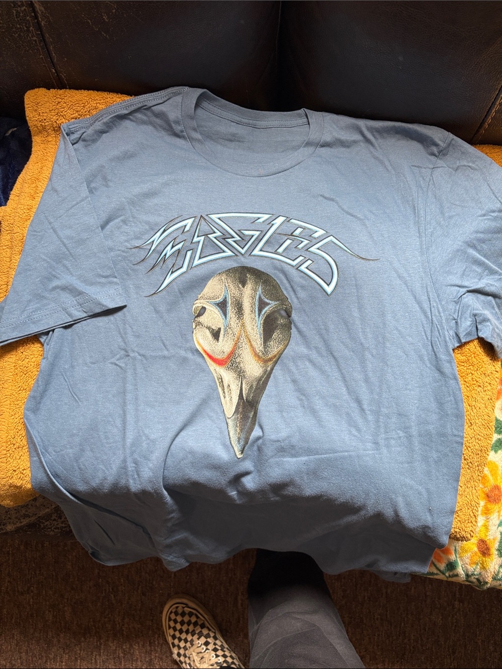 Blue Graphic Tee with Stylized Skull Design, Eagles